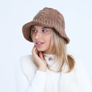 Close-up of coffee brown chunky cable knit bucket hat with thick wool texture