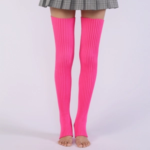 Close-up of fluorescent pink ribbed knit leg warmers with stirrup design for ballet