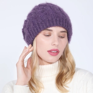 Detailed texture of purple cable knit beret with sparkling yarn and soft fuzzy wool finish