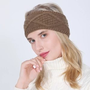 Detailed view of the brown chunky knit headband with intricate diamond cable pattern