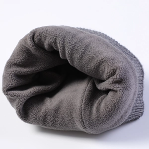 Detail of warm grey winter beanie with thick thermal fleece lining and ribbed knit texture