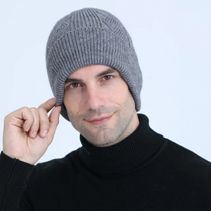 Detail of grey cable knit beanie with vertical ribbed texture and warm fleece lining
