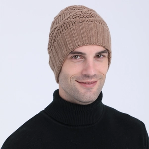 Detail of a brown knit beanie with diamond pattern and ribbed texture for winter warmth