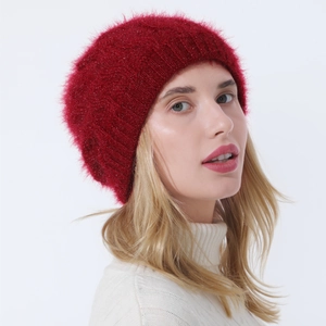 Close-up of red knit beret with metallic glitter thread and soft mohair texture