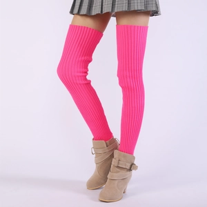 Close-up of neon pink ribbed knit leg warmers showing texture and over-the-knee length