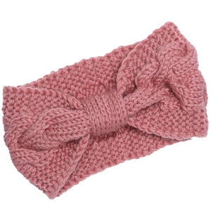 Winter knitted twist bow headband in dusty pink for women featuring warm braided texture