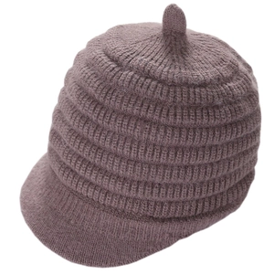 Detailed knit texture and short brim of a warm women's winter peak beanie hat