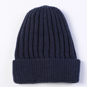 Detailed view of the dark blue ribbed knit pattern on this thick winter beanie cap