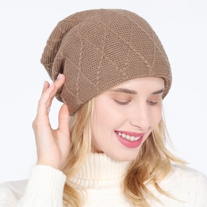Detailed knit texture of brown diamond-patterned wool beanie for autumn and winter
