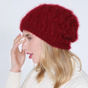 Detail of dark red knit beanie with metallic glitter thread and soft plush texture