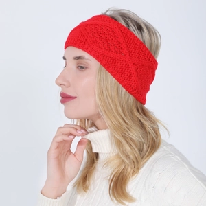 Detail of red cable knit headband showing thick diamond weave texture on female model