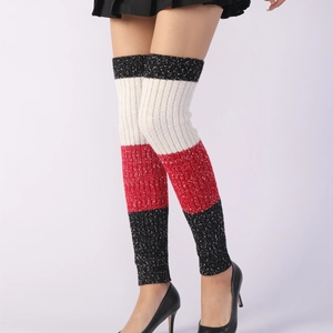 Thick knitted leg warmers with black white and red horizontal stripes for winter warmth