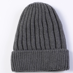 Detailed view of the dark grey ribbed knit beanie with soft wool texture and wide cuff