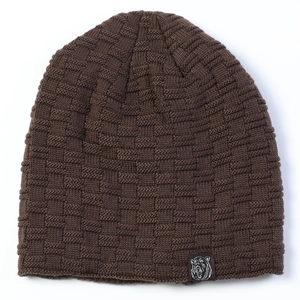 Close-up of brown waffle knit beanie showing texture and square animal logo patch