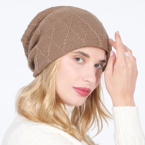 Close-up of brown knit beanie featuring a diamond mesh pattern on a female model