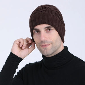 Detailed view of the dark brown knitted beanie showing rib cuff and honeycomb texture