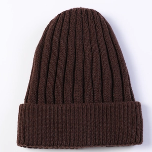 Close-up of thick ribbed knit texture on a dark brown winter thermal beanie hat