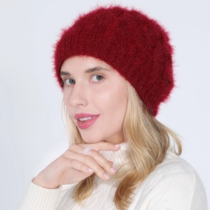 Close-up of wine red knitted beret with soft mohair texture and twist cable pattern