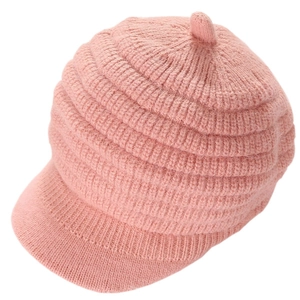 Close-up of pink striped knit beret with visor showing thick texture and warm material