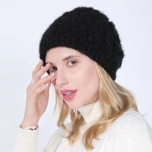 Detail of black knitted beret for women featuring shimmering glitter yarn and soft texture