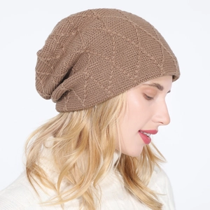 Side view of brown knitted beanie showing diamond patterns and soft thermal texture