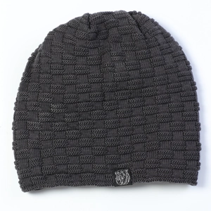 Detail view of dark grey beanie with square knit texture and bear logo patch