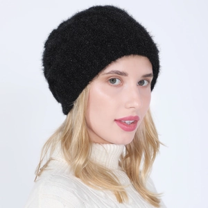 Close-up of black knitted beanie with soft plush texture and shimmering silver sparkles