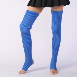 Detail of blue ribbed knit over-the-knee leg warmers with stirrup design for yoga