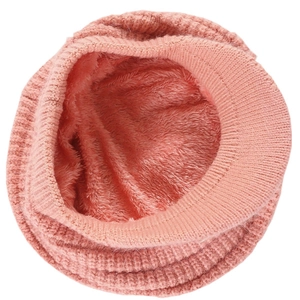 Detail view of pink knitted beanie with thick fleece lining for cold winter warmth