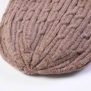Close-up of premium camel cable knit pattern on heavy wool beanie for men