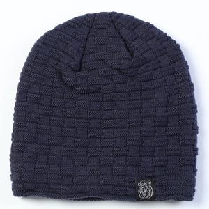 Detailed knit texture and bear patch on a navy blue winter beanie cap for men