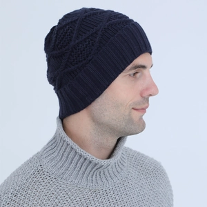 Detail of navy knit beanie showing argyle pattern and ribbed texture on side profile
