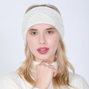 Close-up of white knit headband featuring cable patterns and center twist on model