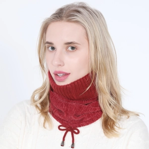 Detail of dark red ribbed knit neck warmer featuring a drawstring bow and silver aglets