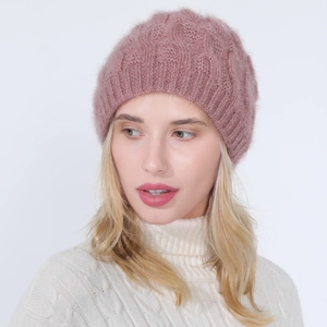 Detail of pink knit beanie with silver tinsel yarn and twist cable pattern design
