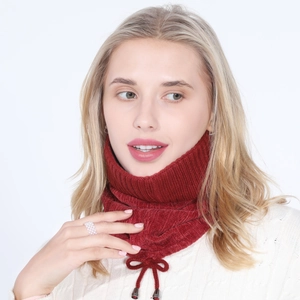 Detail of dark red ribbed knit snood scarf with adjustable drawstrings and metallic tips