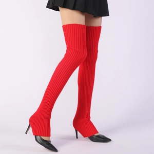 Macro detail of red ribbed knit over-the-knee leg warmers for yoga and ballet