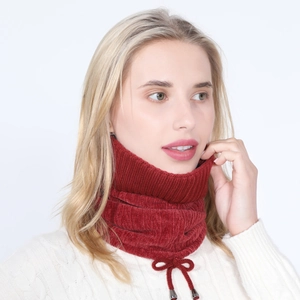 Detail of wine red ribbed knit neck warmer with adjustable drawstring and metal tips