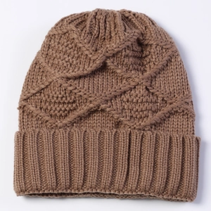 Detailed close-up of brown knit beanie showing diamond texture and folded cuff