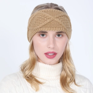 Close-up of khaki chunky knit headband featuring a twist knot and diamond cable pattern