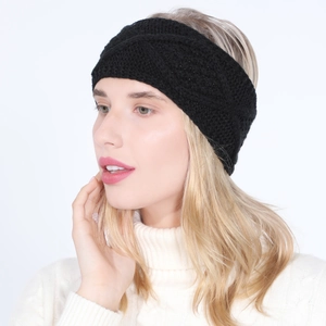 Close-up of black cable knit headband with twisted design on female model in winter