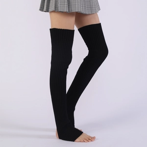 Detail of black ribbed knit over-knee leg warmers with stirrup heel for ballet and yoga