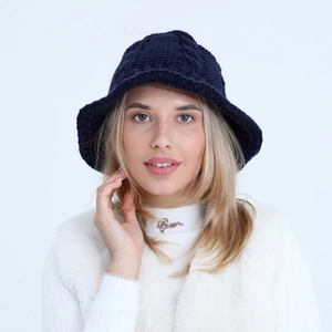Detail of navy blue chunky knit bucket hat showing warm texture and stylish weaving