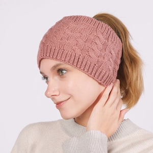Detail of cable knit headband in dusty pink with open back design for high ponytail