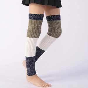 Detailed knit texture of tricolor knee-high leg warmers in navy, olive and beige