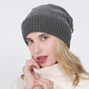 Close-up of thick ribbed knit texture on a dual-use grey beanie with ear protection