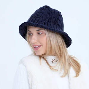 Detail of twisted knit pattern on navy blue winter bucket hat for women