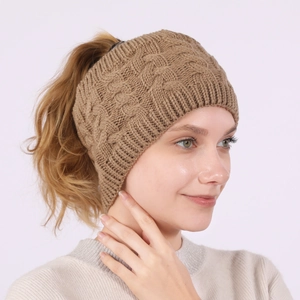 Brown chunky knit ponytail headband with twist pattern for winter outdoor warmth