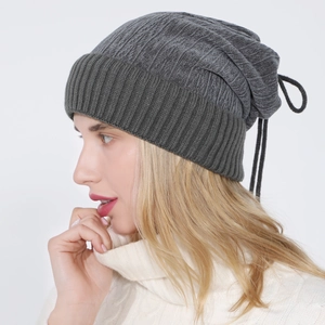 Detail of dark grey ribbed knit cuff and light grey textured fabric on beanies