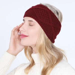 Close-up of wine red cable knit headband showing intricate crossover texture and pattern